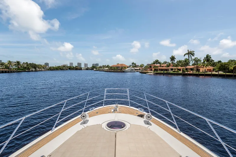  Yacht Photos Pics Bow view of 2013 Azimut 64 yacht cruising on a sunny day.