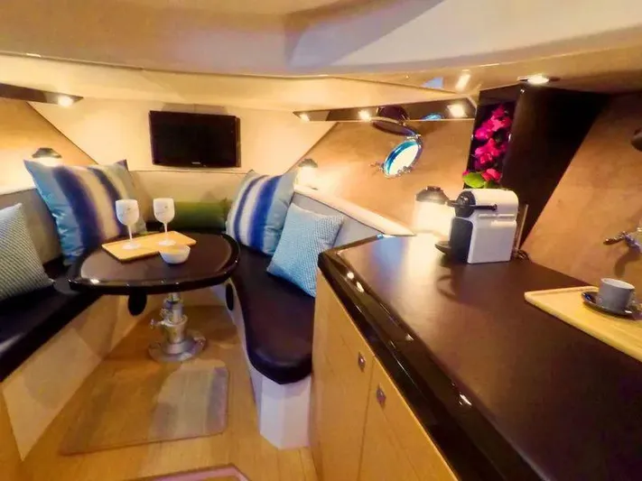  Yacht Photos Pics Luxurious interior of 2013 Sessa Marine Key Largo 36 yacht with cozy seating and modern amenities.