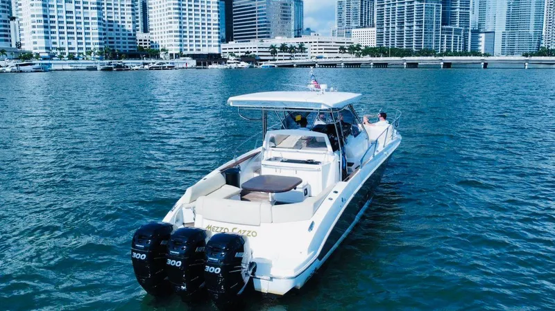  Yacht Photos Pics Sessa Marine Key Largo 36 boat, 2013 model, cruising near city skyline.