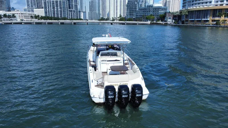  Yacht Photos Pics Sessa Marine Key Largo 36 boat, 2013 model, cruising in urban waterfront setting.