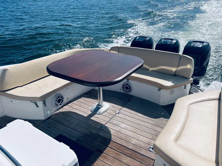  Yacht Photos Pics Sessa Marine Key Largo 36, 2013 model, features spacious deck seating and table on open water.