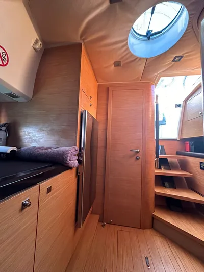  Yacht Photos Pics Interior of 2013 Sessa Marine Key Largo 36 with wooden cabinetry and stairs.