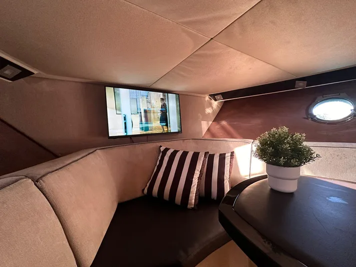  Yacht Photos Pics Luxurious interior of 2013 Sessa Marine Key Largo 36 with cozy seating and TV.