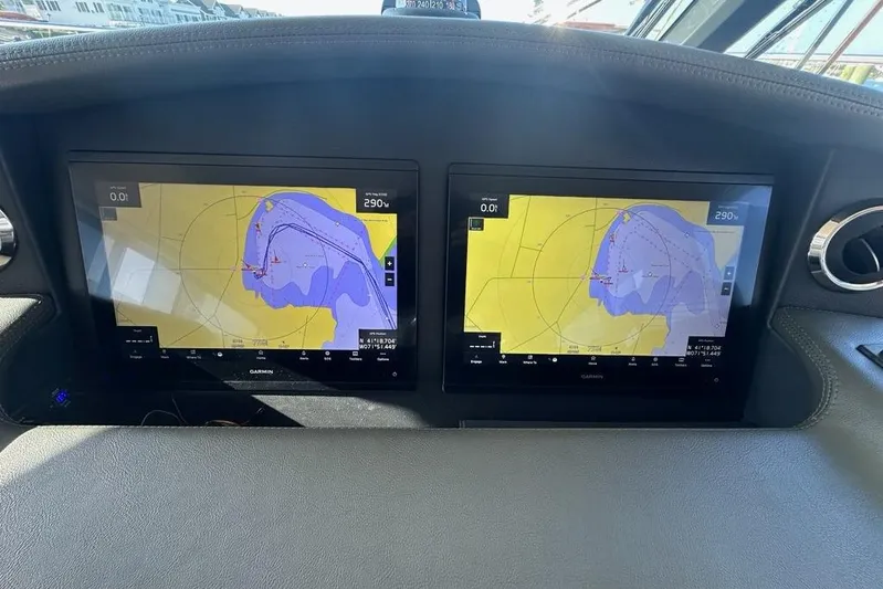 Happy Ours Yacht Photos Pics Dashboard of 2019 Riviera 5400 Sport Yacht with dual Garmin navigation screens.