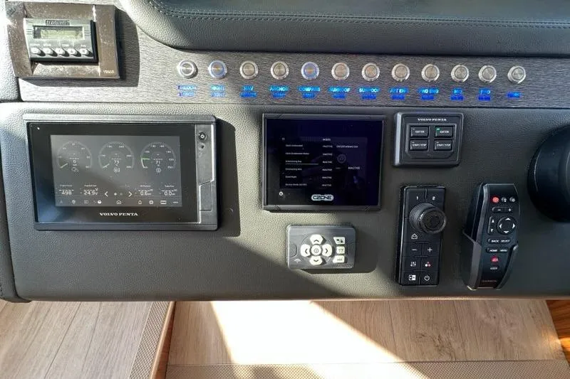 Happy Ours Yacht Photos Pics Control panel of a 2019 Riviera 5400 Sport Yacht with various navigation instruments.