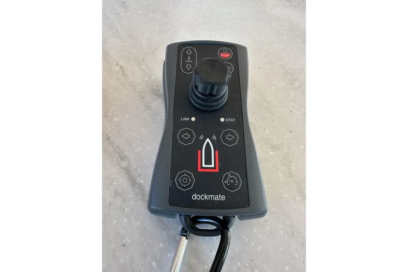 Happy Ours Yacht Photos Pics Remote control for 2019 Riviera 5400 Sport Yacht, featuring joystick and control buttons.