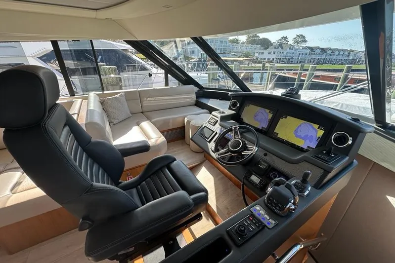 Happy Ours Yacht Photos Pics Luxurious 2019 Riviera 5400 Sport Yacht interior with modern helm and plush seating.