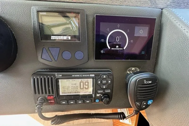 Happy Ours Yacht Photos Pics Control panel of a 2019 Riviera 5400 Sport Yacht with navigation and communication equipment.