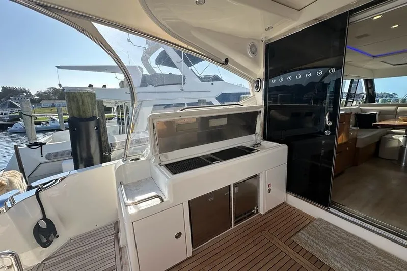 Happy Ours Yacht Photos Pics 2019 Riviera 5400 Sport Yacht with outdoor kitchen and luxurious interior.