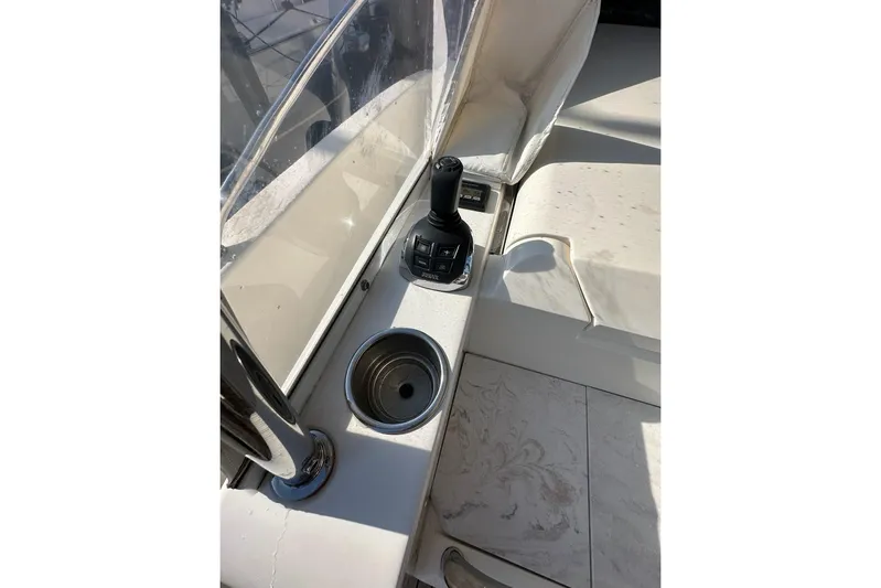 Happy Ours Yacht Photos Pics 2019 Riviera 5400 Sport Yacht control panel with joystick and cup holder.