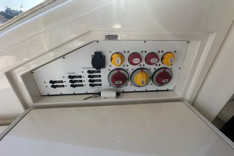 Happy Ours Yacht Photos Pics Control panel of 2019 Riviera 5400 Sport Yacht with switches and dials.