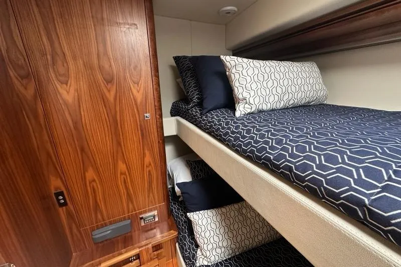 Happy Ours Yacht Photos Pics Bunk beds in 2019 Riviera 5400 Sport Yacht cabin with geometric bedding.