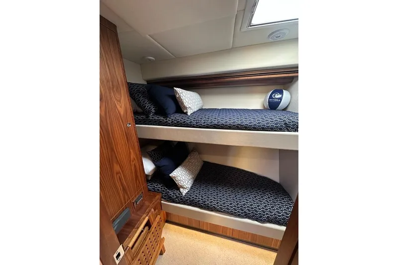 Happy Ours Yacht Photos Pics Bunk beds in 2019 Riviera 5400 Sport Yacht cabin with stylish bedding and wooden cabinetry.