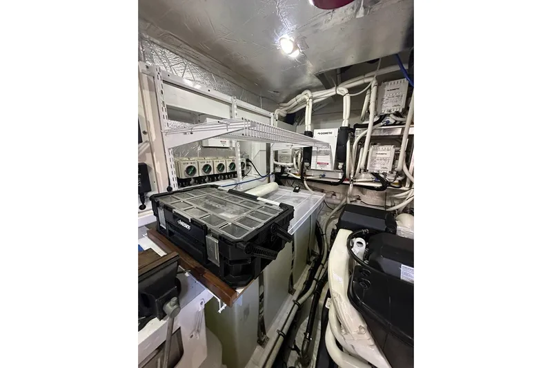 Happy Ours Yacht Photos Pics Engine room of 2019 Riviera 5400 Sport Yacht with mechanical components and wiring.