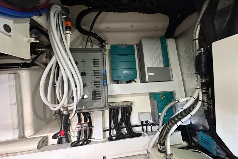 Happy Ours Yacht Photos Pics Engine room of 2019 Riviera 5400 Sport Yacht with electrical components and wiring.