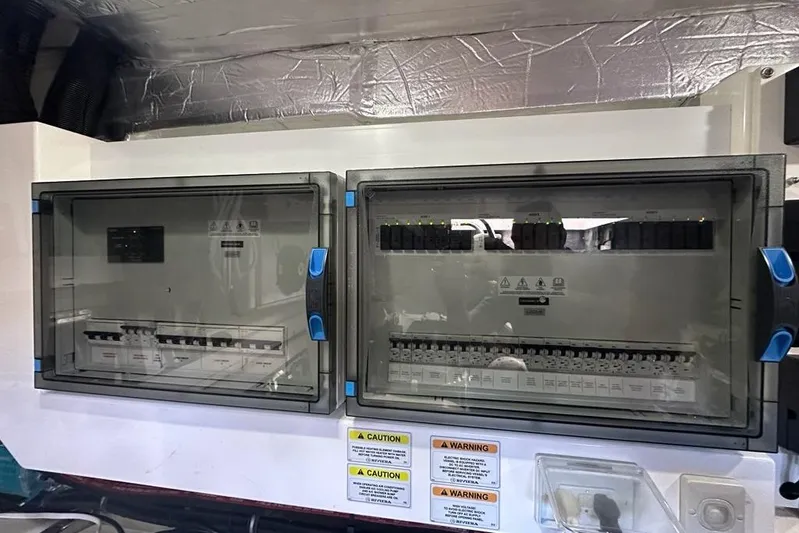 Happy Ours Yacht Photos Pics Electrical control panels on a 2019 Riviera 5400 Sport Yacht.