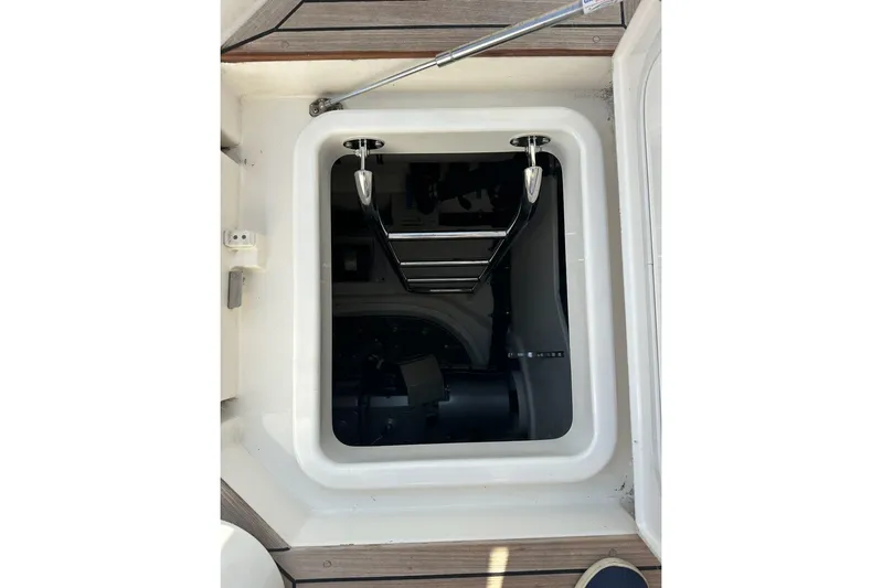 Happy Ours Yacht Photos Pics Hatch opening on 2019 Riviera 5400 Sport Yacht, showcasing interior access.