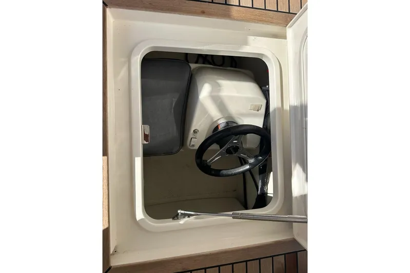 Happy Ours Yacht Photos Pics 2019 Riviera 5400 Sport Yacht helm station with steering wheel and controls.