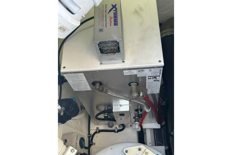 Happy Ours Yacht Photos Pics Engine room of 2019 Riviera 5400 Sport Yacht with mechanical components and wiring.