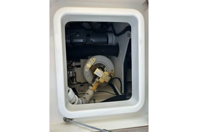 Happy Ours Yacht Photos Pics Engine compartment of 2019 Riviera 5400 Sport Yacht, showcasing mechanical components.