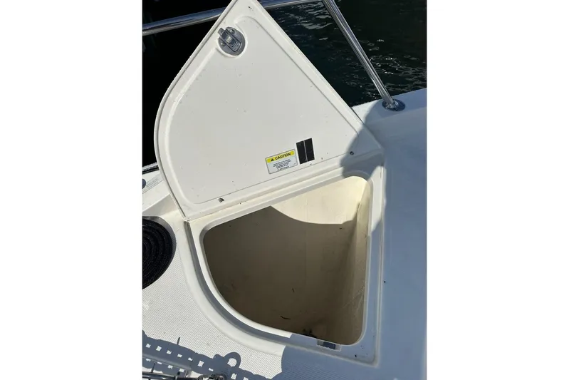 Happy Ours Yacht Photos Pics Open storage compartment on 2019 Riviera 5400 Sport Yacht deck.