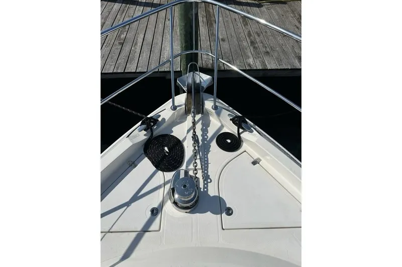 Happy Ours Yacht Photos Pics Bow of 2019 Riviera 5400 Sport Yacht with anchor chain and deck details.