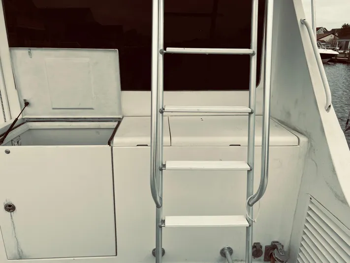 Rock & Roll IV Yacht Photos Pics Egg Harbor 42 Sport Fish 2002 boat ladder and storage compartments.