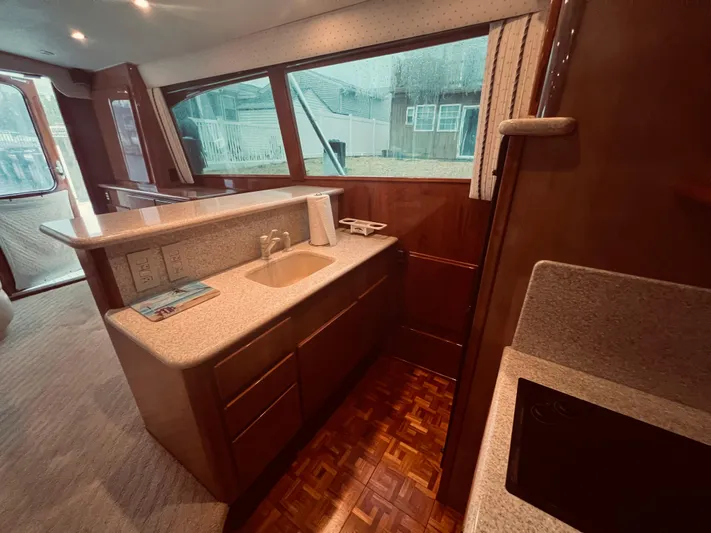 Rock & Roll IV Yacht Photos Pics Interior of 2002 Egg Harbor 42 Sport Fish yacht with kitchen and sink area.