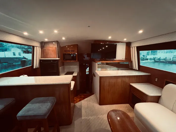 Rock & Roll IV Yacht Photos Pics Interior of 2002 Egg Harbor 42 Sport Fish yacht with modern kitchen and seating area.