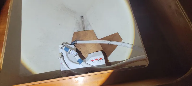 Termo Yacht Photos Pics A 2000 Custom Holland Hardtop Cruiser interior with plumbing components and wooden paneling.