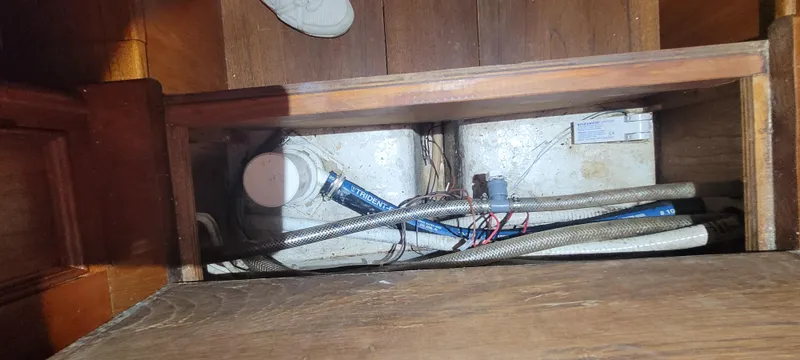 Termo Yacht Photos Pics Bilge area of 2000 Custom Holland Hardtop Cruiser with visible pipes and wiring.