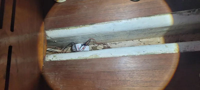 Termo Yacht Photos Pics Wooden interior of a 2000 Custom Holland Hardtop Cruiser, showing wiring in a compartment.