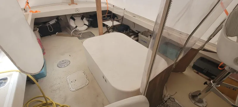 Termo Yacht Photos Pics Interior of a 2000 Custom Holland Hardtop Cruiser boat, featuring seating and storage areas.