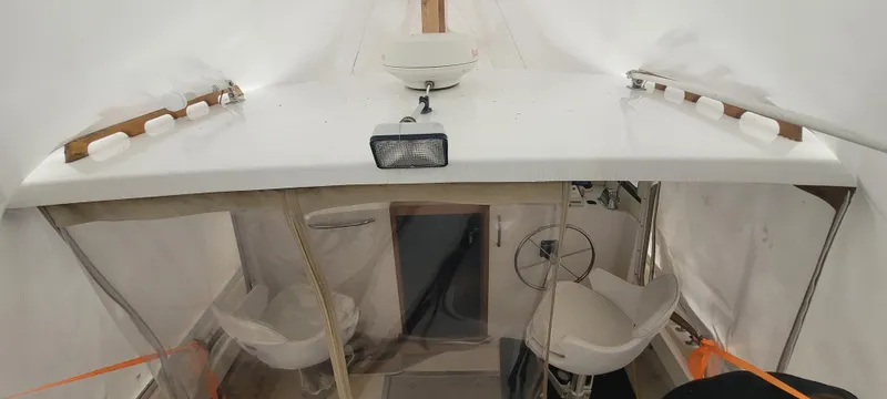 Termo Yacht Photos Pics Custom 2000 Holland Hardtop Cruiser interior with seating and steering wheel.