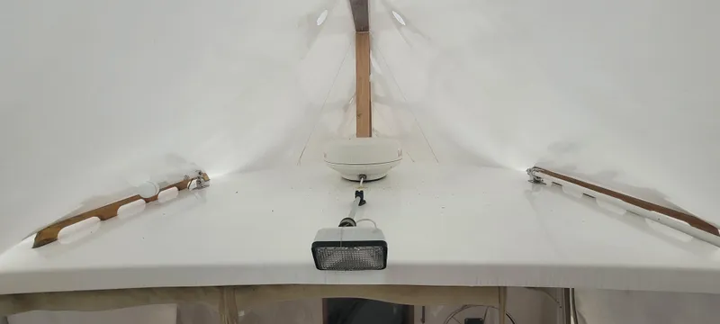 Termo Yacht Photos Pics Custom 2000 Holland Hardtop Cruiser interior with white ceiling and wooden accents.