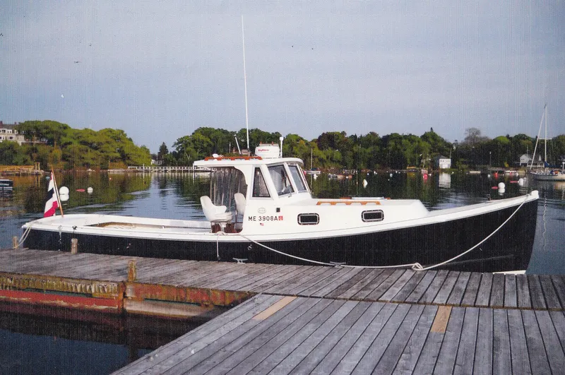 Termo Yacht Photos Pics Custom 2000 Holland Hardtop Cruiser docked in a serene marina setting.