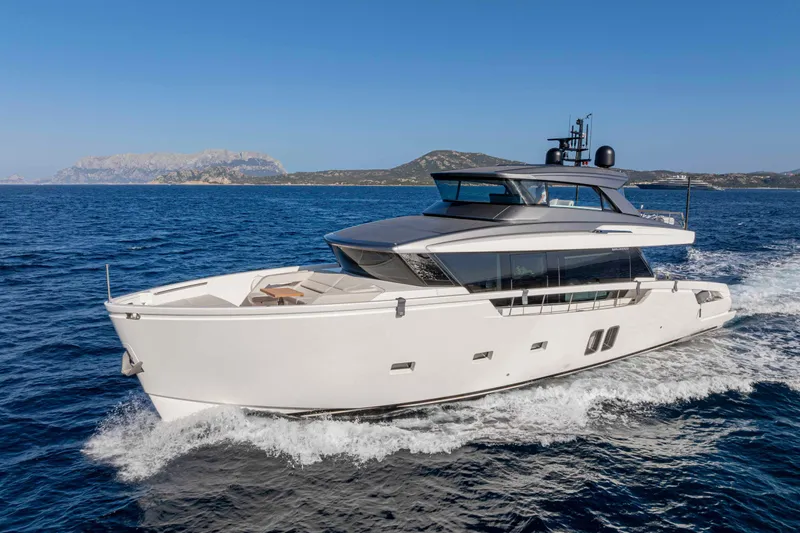 Firefly Yacht Photos Pics 2025 Sanlorenzo SX76 yacht cruising on open sea with scenic coastal backdrop.