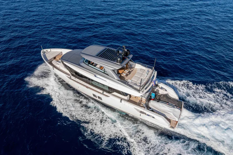 Firefly Yacht Photos Pics Aerial view of 2025 Sanlorenzo SX76 yacht cruising on open sea.