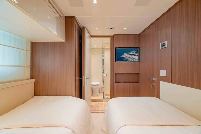 Firefly Yacht Photos Pics Luxurious Sanlorenzo SX76 2025 yacht cabin with twin beds and ensuite bathroom.