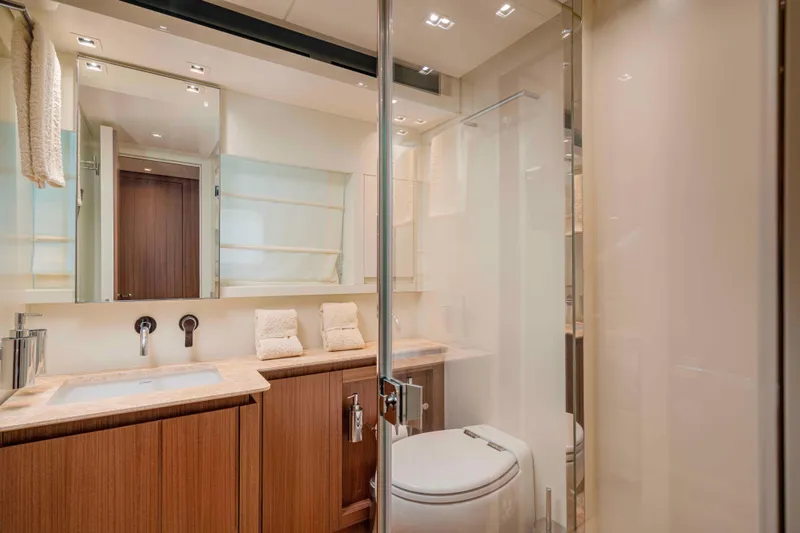 Firefly Yacht Photos Pics Luxurious bathroom in 2025 Sanlorenzo SX76 yacht with modern fixtures and elegant design.