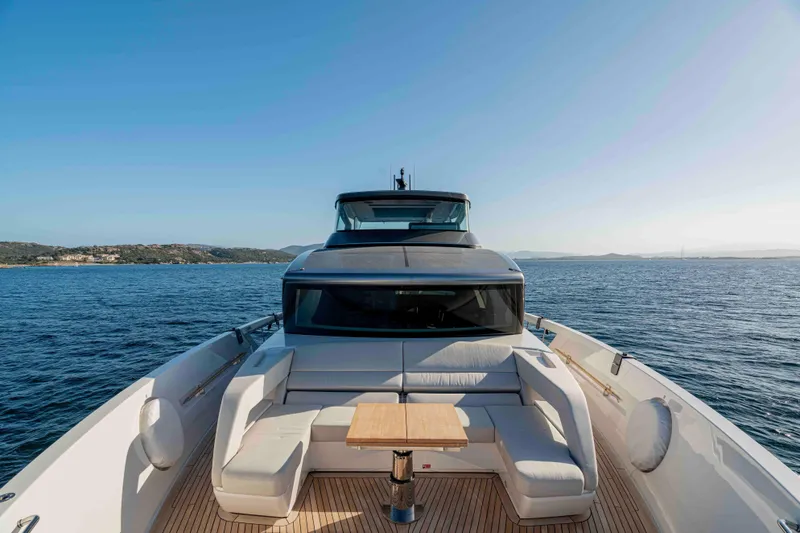 Firefly Yacht Photos Pics Luxurious 2025 Sanlorenzo SX76 yacht with elegant deck seating on open sea.