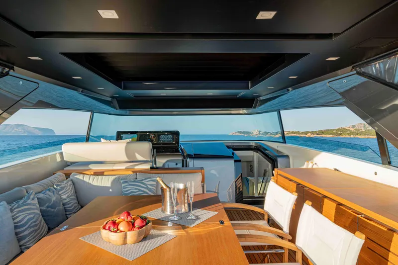 Firefly Yacht Photos Pics Luxurious 2025 Sanlorenzo SX76 yacht interior with elegant dining area and scenic ocean view.