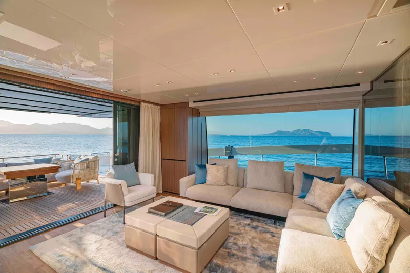 Firefly Yacht Photos Pics Luxurious interior of 2025 Sanlorenzo SX76 yacht with ocean view and elegant furnishings.