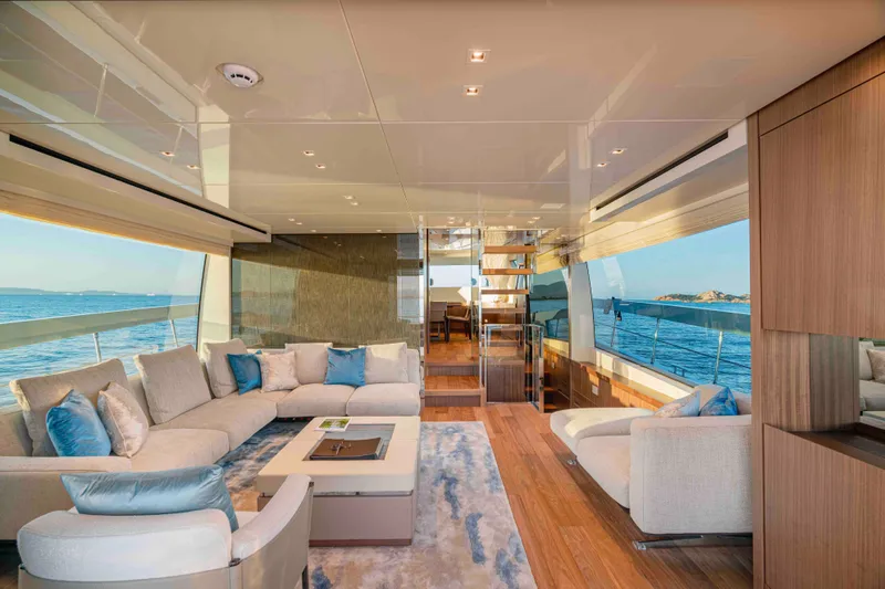 Firefly Yacht Photos Pics Luxurious interior of 2025 Sanlorenzo SX76 yacht with ocean view and modern furnishings.