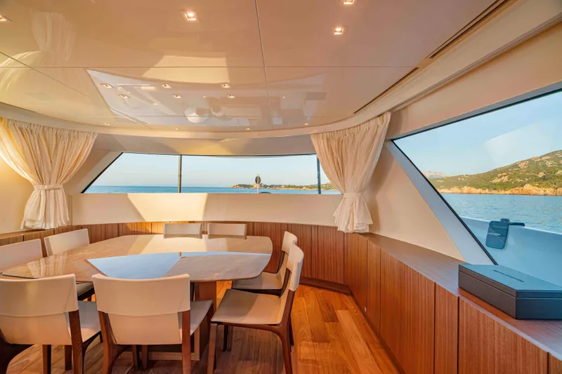 Firefly Yacht Photos Pics Luxurious interior of 2025 Sanlorenzo SX76 yacht with panoramic ocean views.