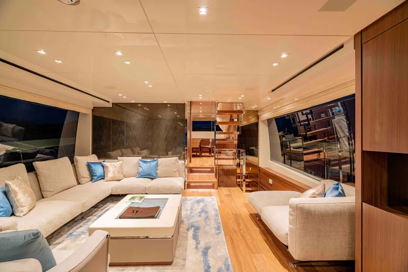 Firefly Yacht Photos Pics Luxurious interior of 2025 Sanlorenzo SX76 yacht with elegant seating and modern design.