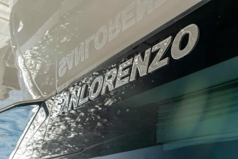 Firefly Yacht Photos Pics Sanlorenzo SX76 yacht, 2025 model, with reflective logo detail.