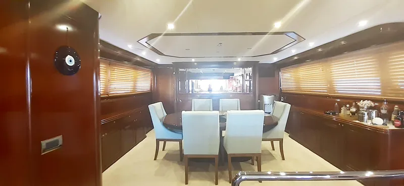 An Yacht Photos Pics Luxurious dining area inside a 1997 Vitters motoryacht with elegant wood paneling and modern furnishings.