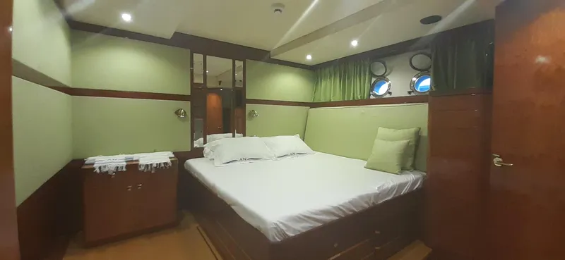 An Yacht Photos Pics Luxurious 1997 Vitters Motoryacht cabin with elegant bedding and ambient lighting.