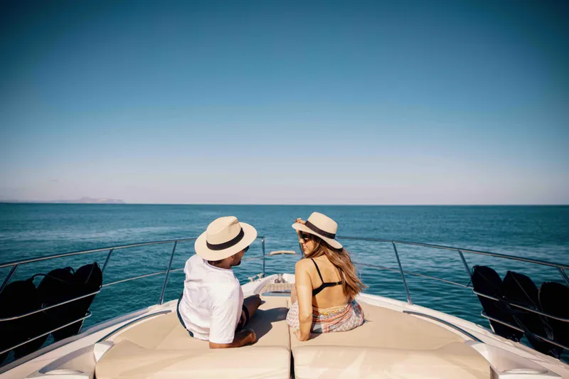  Yacht Photos Pics Couple relaxing on 2008 Sessa Marine C46 yacht, enjoying ocean view.